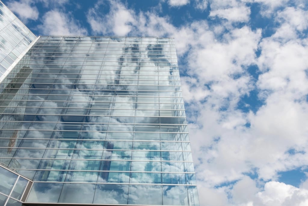 Glass office building seen from below