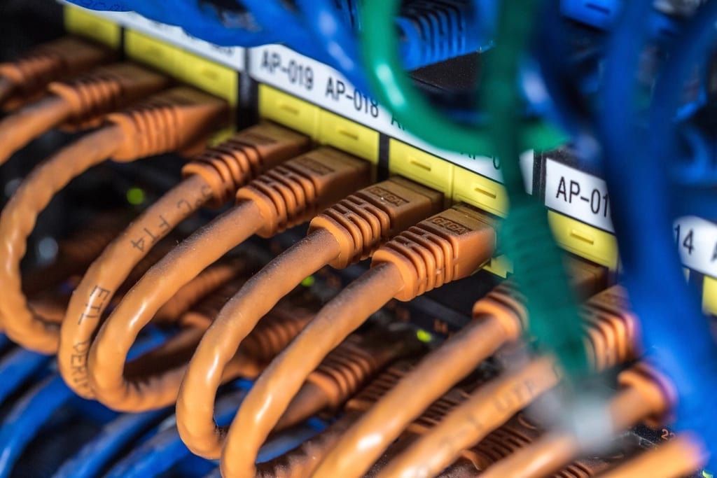 Network cables terminating in a patch panel